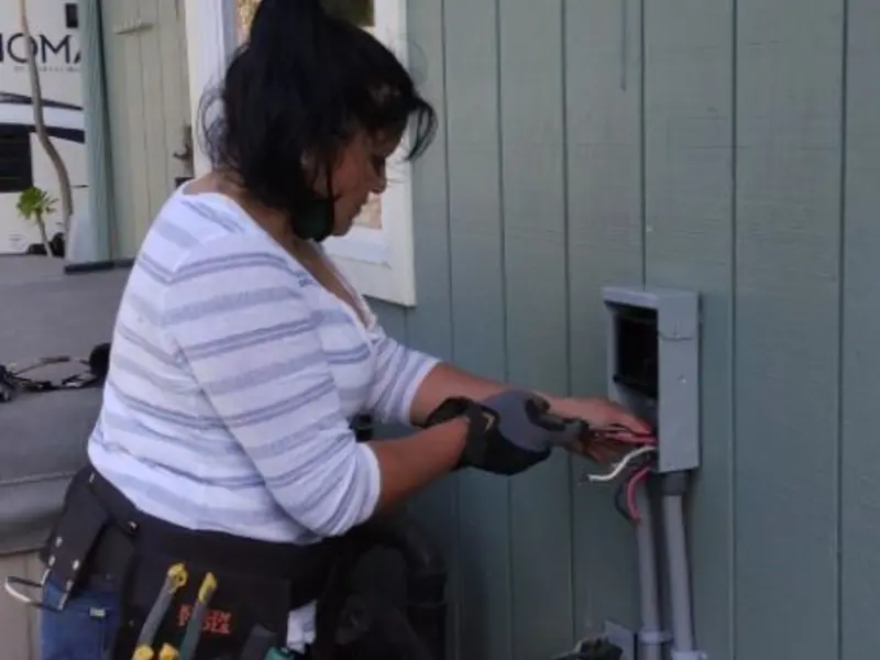 Licensed electrician wiring an exterior subpanel in Weymouth Town