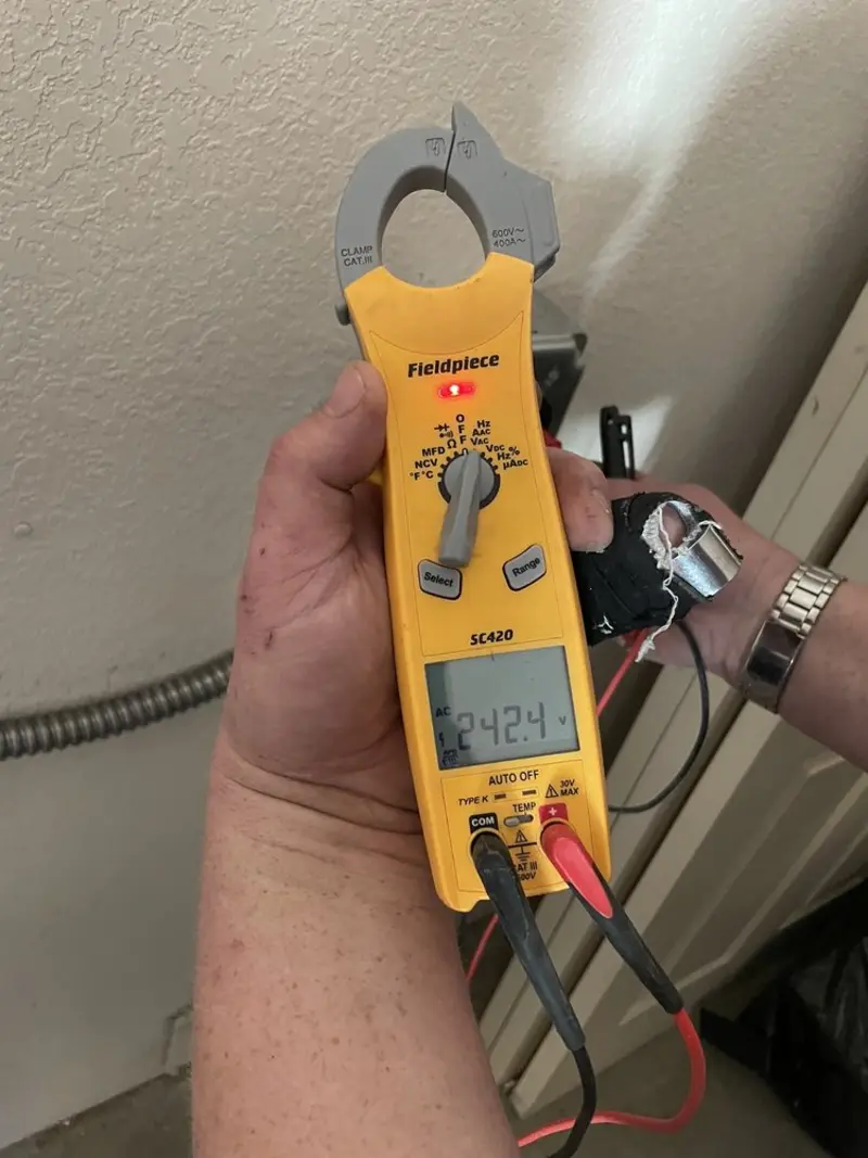 Voltage testing with clamp meter during Outlet Installation in Weymouth Town